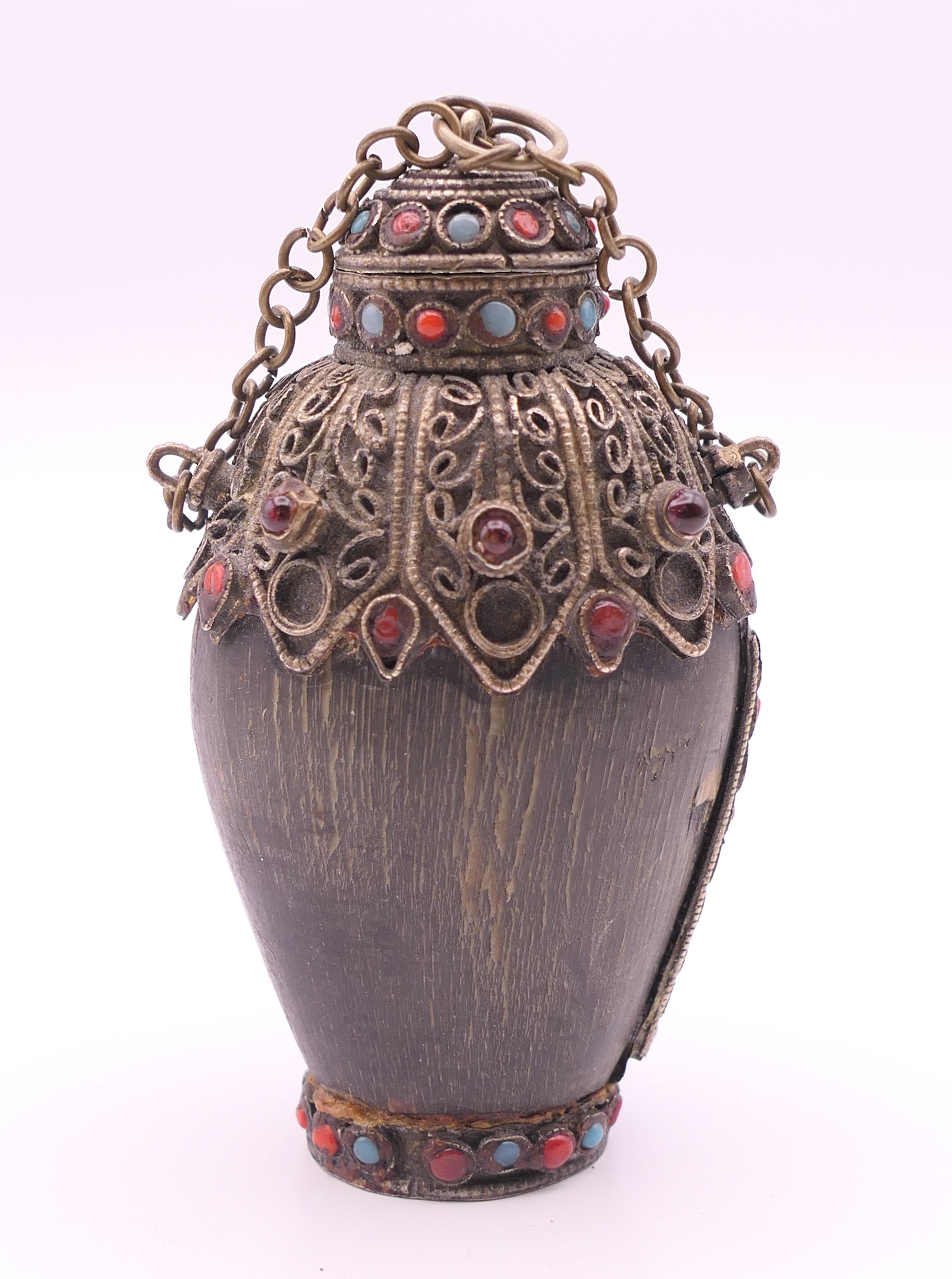 A Tibetan horn snuff bottle. 8 cm high.