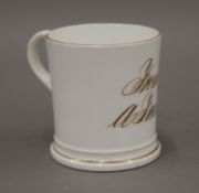 A 19th century porcelain cup inscribed 'From A Friend'. 7.5 cm high.