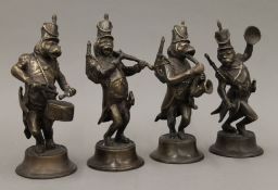 A set of four brass monkey band figures. The largest 22 cm high.