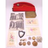 A 1914 Christmas tin with badges, a Middlesex Yeomanry side cap,