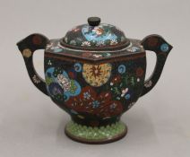 A 19th century Chinese cloisonne lidded pot. 11 cm high.