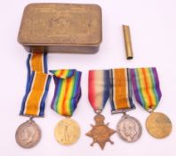 A 1914 Christmas tin with five medals including a trio awarded to 4941 1AM C A BATMAN RFC,