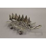A silver plate toast rack formed as ivy leaves. 21 cm long.