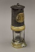 A Thomas Williams Ltd of Aberdare miner's lamp. 25 cm high.