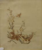 A pair of Japanese embroidered silk works depicting birds on branches,