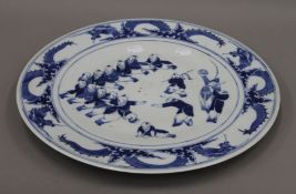 An 18th/19th century Chinese blue and white porcelain charger. 37.5 cm diameter.