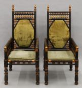 A pair of armchairs in the Carlo Bugatti manner. 56 cm wide.