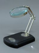 A magnifying glass on stand.