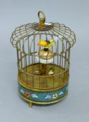 A cloisonne bird cage clock. 19 cm high.