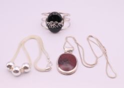 A quantity of silver jewellery. Pendant 5.5 cm high.