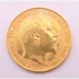 A 1908 gold half sovereign.