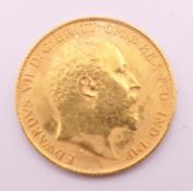 A 1908 gold half sovereign.