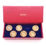 A set of six Cartier silver gilt buttons.