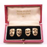 A pair of 9 ct gold cufflinks formed as comedy and tragedy theatre masks. 1.5 cm high. 10.