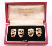 A pair of 9 ct gold cufflinks formed as comedy and tragedy theatre masks. 1.5 cm high. 10.