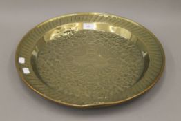 An antique brass Alms dish. 44.5 cm diameter.