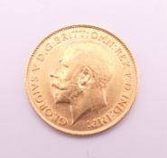A 1913 gold half sovereign.