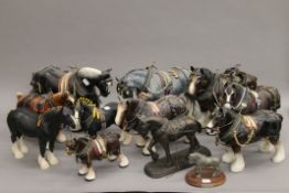 A collection of various model shire horses, including one Beswick.