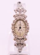 A Jules Jurgensen 14 K white gold ladies wristwatch set with 38 diamonds.