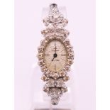 A Jules Jurgensen 14 K white gold ladies wristwatch set with 38 diamonds.