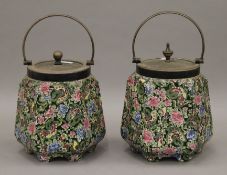 A pair of Chintz decorated biscuit barrels. 21 cm high overall.
