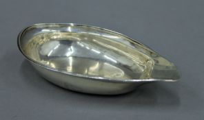 A George III silver pap boat, hallmarked for London 1805. 14 cm long. 57.2 grammes.