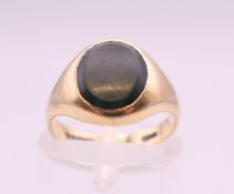 A 9 ct gold and bloodstone signet ring. Ring size J. 3 grammes total weight.