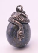 A silver and lapis egg formed pendant. 2.5 cm high.