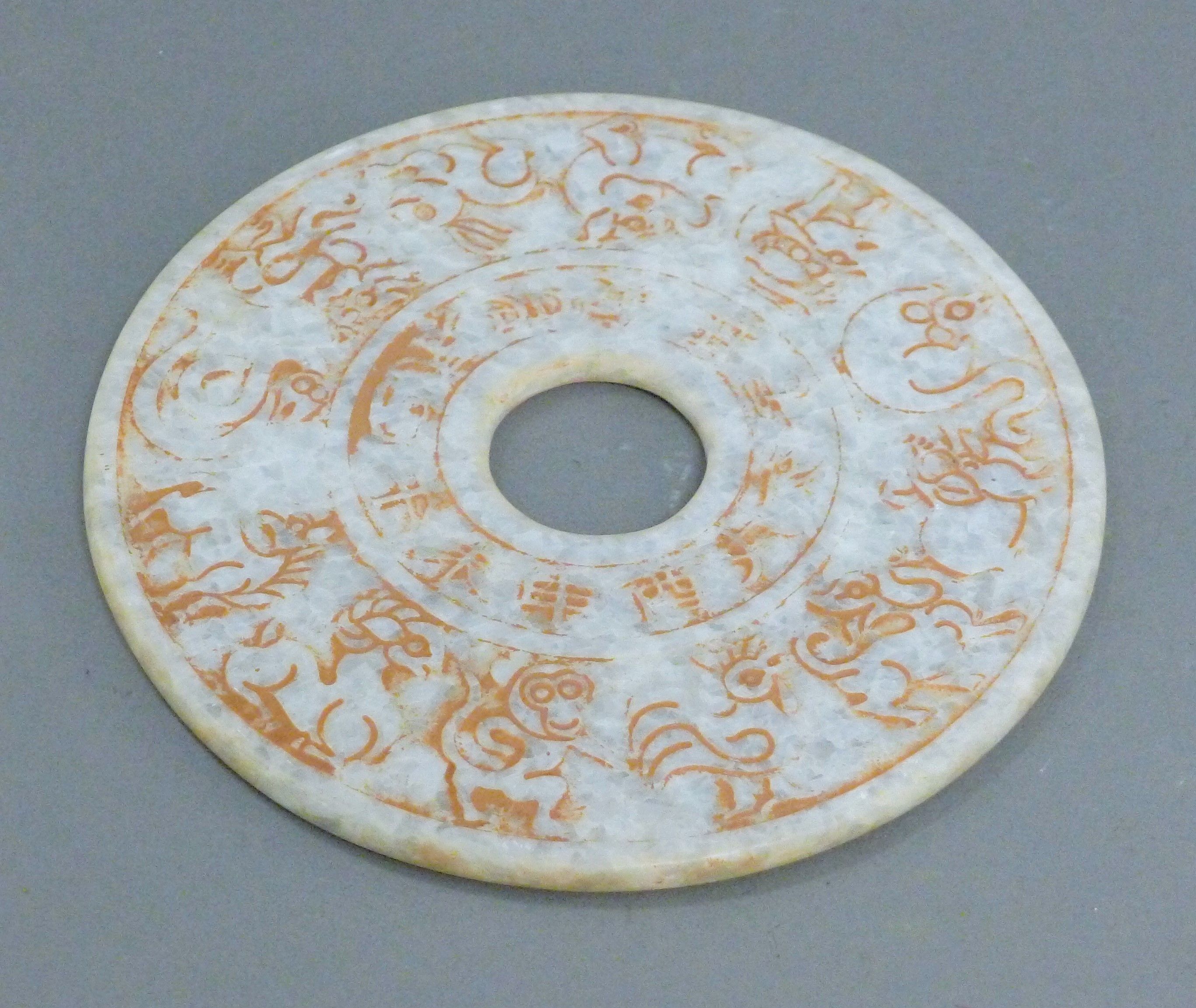 A white jade bi disc. 20 cm diameter.