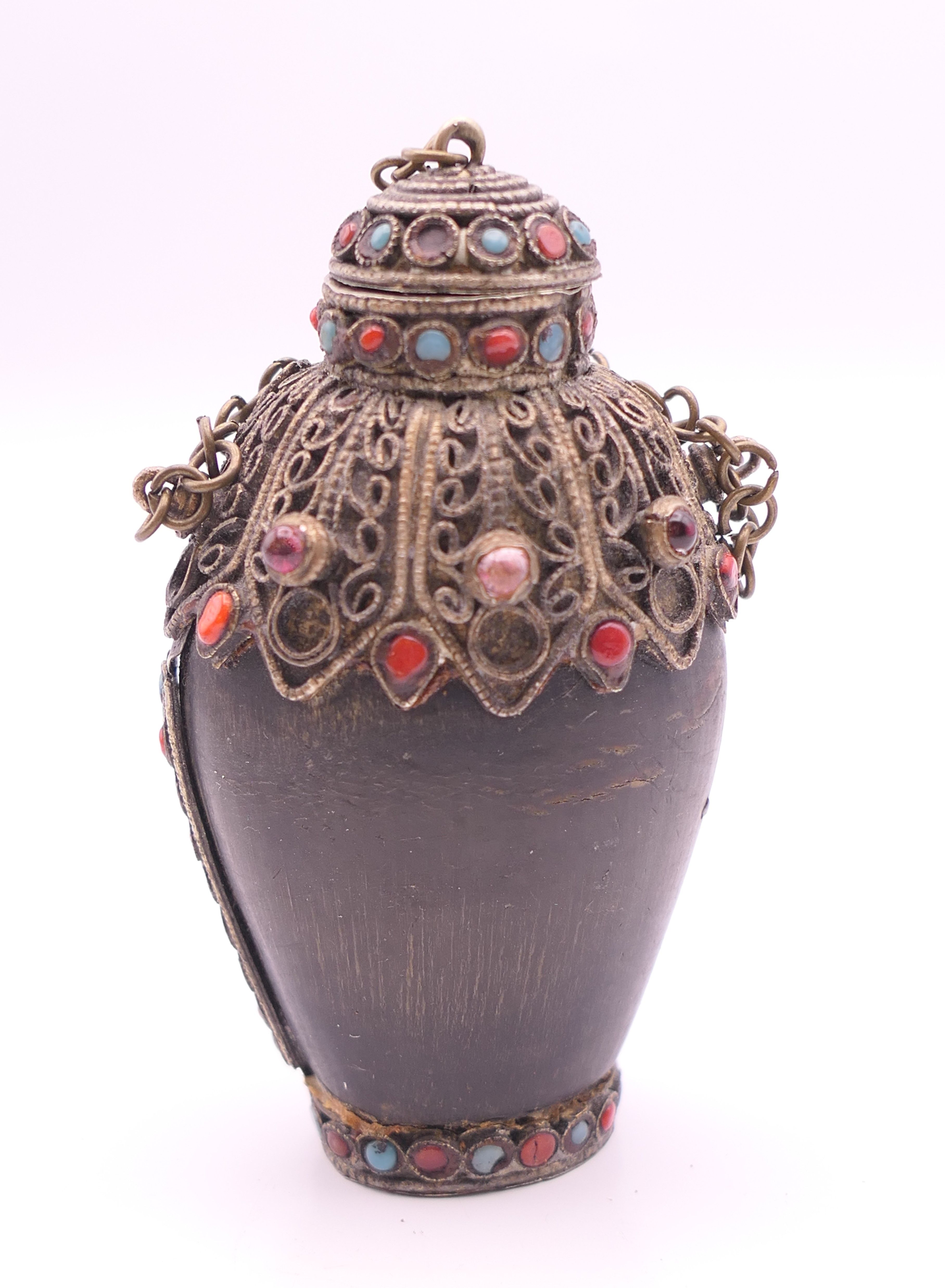 A Tibetan horn snuff bottle. 8 cm high. - Image 2 of 5