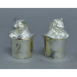 A pair of silver plated cat in hat salt and peppers.