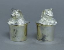 A pair of silver plated cat in hat salt and peppers.