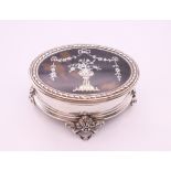 An Edwardian oval silver and tortoiseshell trinket box, Mappin & Webb, London 1909. 9 x 6 cm.