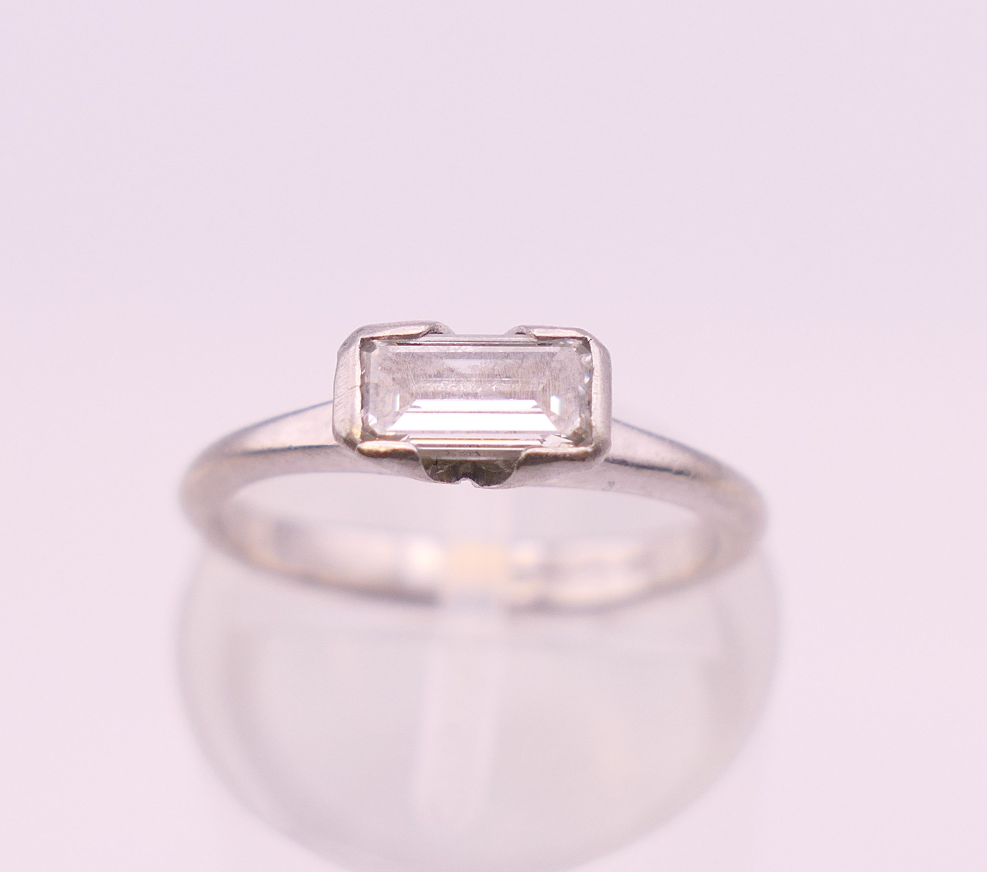 A platinum diamond solitaire ring. Ring size G/H. 3.3 grammes total weight. - Image 3 of 7