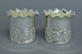 A pair of silver plated coasters. 10 cm diameter.