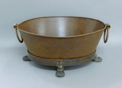 An oval iron planter. 58 cm wide.
