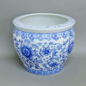 A blue and white porcelain planter. 31 cm high.