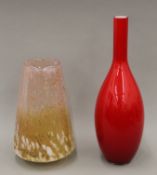 A large gold flecked glass vase and a red glass vase. The latter 50 cm high.