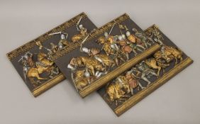 Three plaster plaques of medieval battle scenes. Each 40.5 cm wide.