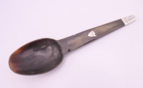 A Scottish unmarked silver mounted horn spoon. 21.25 cm long.