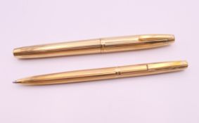 A Sheaffer fountain pen with 14 K gold nib and a Shaeffer ballpoint pen.
