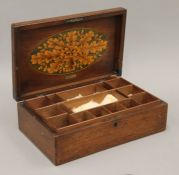 A 19th century mahogany jewellery box with interior inlay. 30 cm wide.