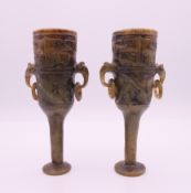 A pair of small Chinese archaic style jade vases. 11 cm high.