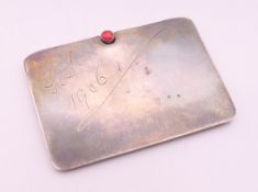 An early 20th century silver stamp case. 5 cm wide.