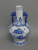 A blue and white elephant handle vase. 42 cm high.