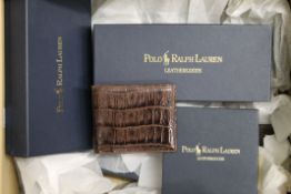 A quantity of new leather wallets, including boxed Ralph Lauren examples.