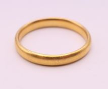 A 22 ct gold wedding band. Ring size X. 6.3 grammes.