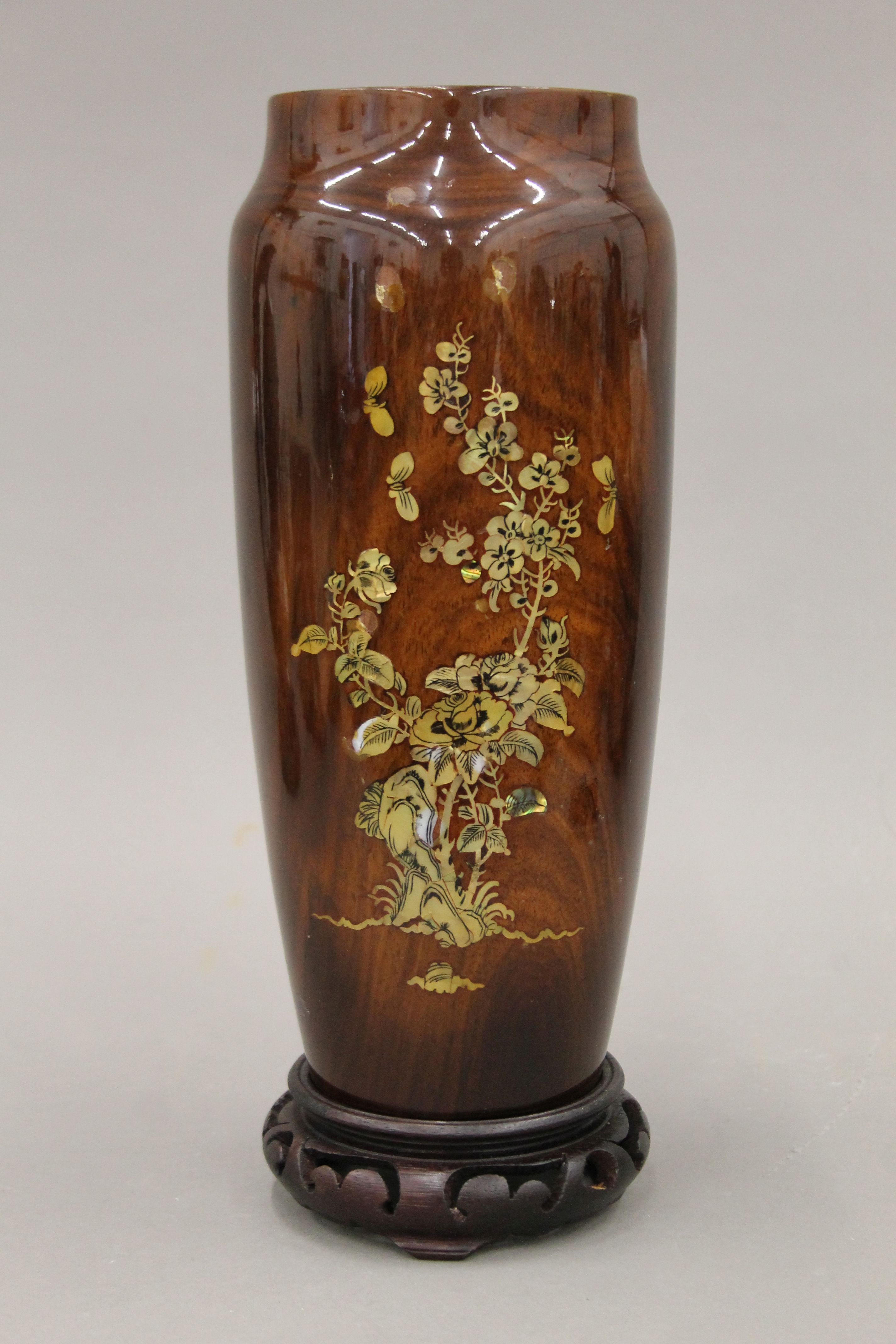 A 19th century Japanese turned wooden lacquered vase with mother-of-pearl inlay on a wooden stand - Image 2 of 8