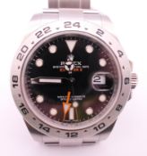 A Rolex Perpetual Date Explorer II watch with black dial, model number 216570,