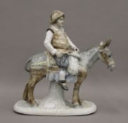 A porcelain model of Sancho Panza, indistinctly signed. 25.5 cm high.